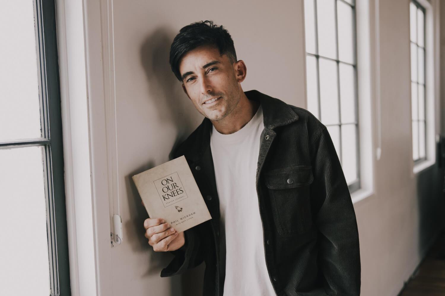 Phil Wickham holding his book